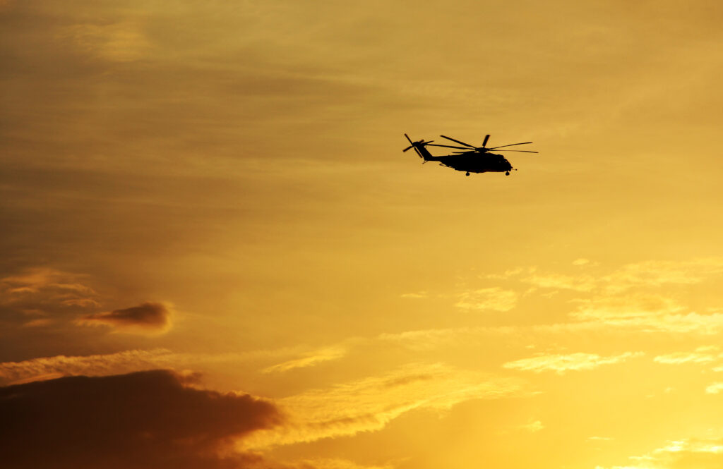 helicopter-s-silhouette-on-the-golden-sky-of-an-am-2025-01-16-11-16-12-utc