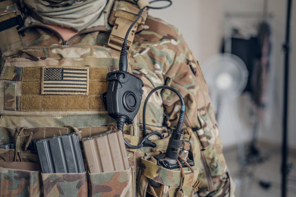 Military man with radio in pocket
